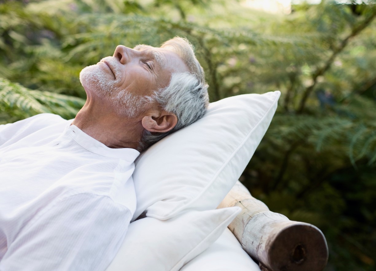 a man with his eyes closed