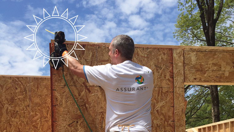 Volunteer working to build a home.